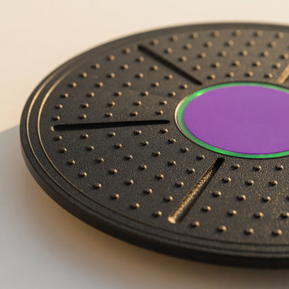 Close-up of balance board trainer showing textured surface and center grip area