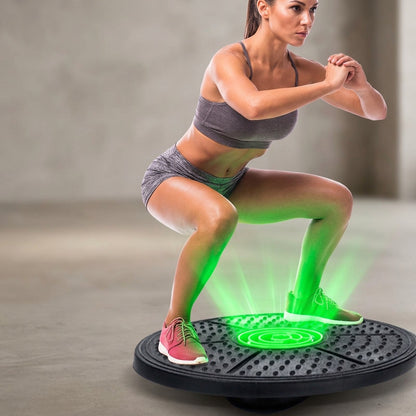 Woman using a balance board trainer for core strength, stability and balance training at home